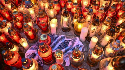 People place candles and flowers for Damian Sobol, an aid worker for World Central Kitchen who was killed by an Israeli airstrike, in front of the train station in Przemysl, Poland, on April 4, 2024.