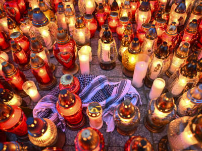 People place candles and flowers for Damian Sobol, an aid worker for World Central Kitchen who was killed by an Israeli airstrike, in front of the train station in Przemysl, Poland, on April 4, 2024.