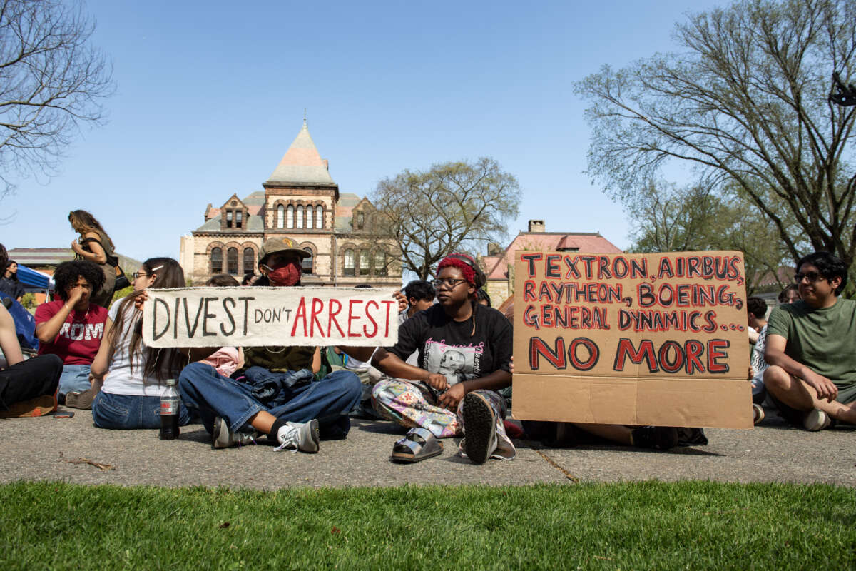 Pro-Palestinian protestors rally at university hall at the pro-Palestinian encampment at Brown University as they await answers from their delegation who are meeting with school leaders on campus in Providence, Rhode Island, on April 29, 2024.