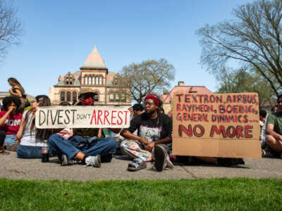 Pro-Palestinian protestors rally at university hall at the pro-Palestinian encampment at Brown University as they await answers from their delegation who are meeting with school leaders on campus in Providence, Rhode Island, on April 29, 2024.