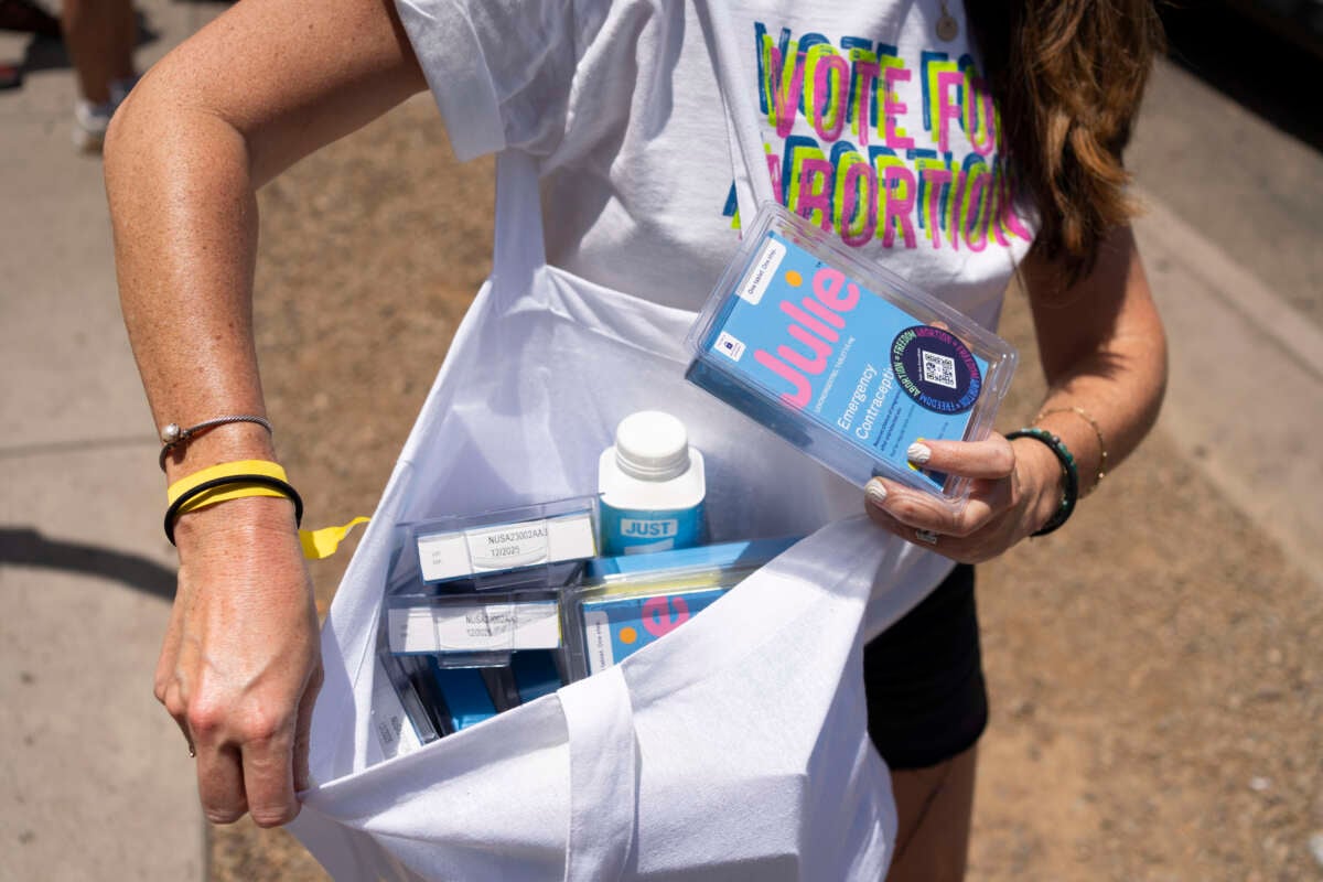 Activists pass out emergency contraception to party-goers while campaigning with Vote for Abortion outside of Maya Dayclub on Saturday, June 8, 2024, in Scottsdale, Arizona.