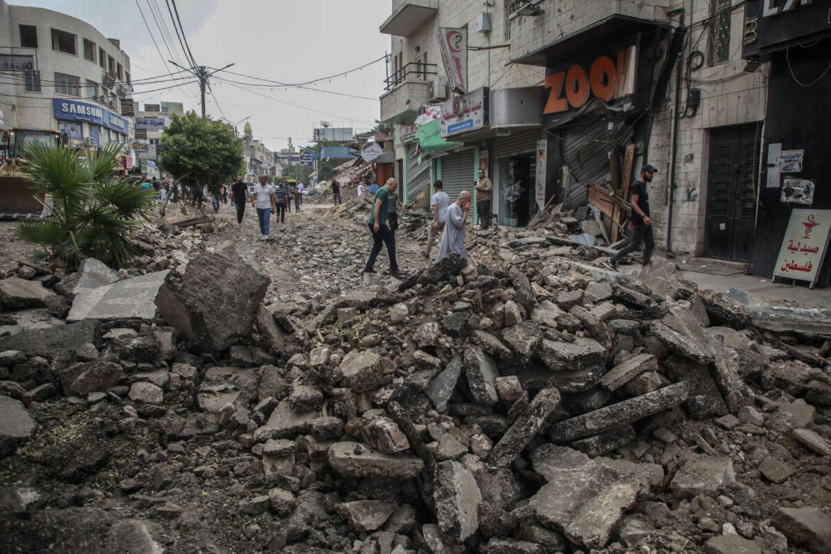 Palestinians inspect the completely destroyed city center of Jenin, in the occupied West Bank, Palestine, after a 10-day deadly operation that left much of the infrastructure and many homes in ruins, on September 6, 2024.