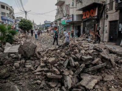 Palestinians inspect the completely destroyed city center of Jenin, in the occupied West Bank, Palestine, after a 10-day deadly operation that left much of the infrastructure and many homes in ruins, on September 6, 2024.