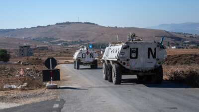 UNIFIL armoured personnel carriers depart a base to patrol near the Lebanon-Israel border on October 5, 2024 in Marjayoun, Lebanon.