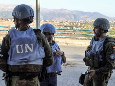 Spanish peacekeepers of the United Nations Interim Force in Lebanon (UNIFIL) coordinate their patrol with the Lebanese Military Police, in Marjayoun in south Lebanon on October 8, 2024.