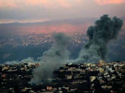 Heavy smoke from Israeli air raids billows from the southern Lebanese border town of Khiam on September 30, 2024.