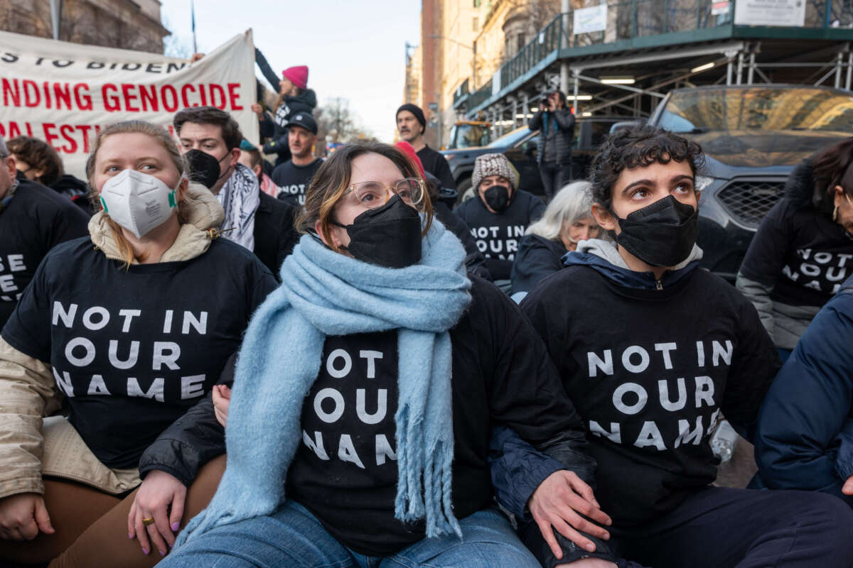 Members of the activist group Jewish Voice for Peace join others in protesting President Joe Biden's visit to Manhattan and calling for a ceasefire between Israel and Hamas, on February 7, 2024, in New York City.