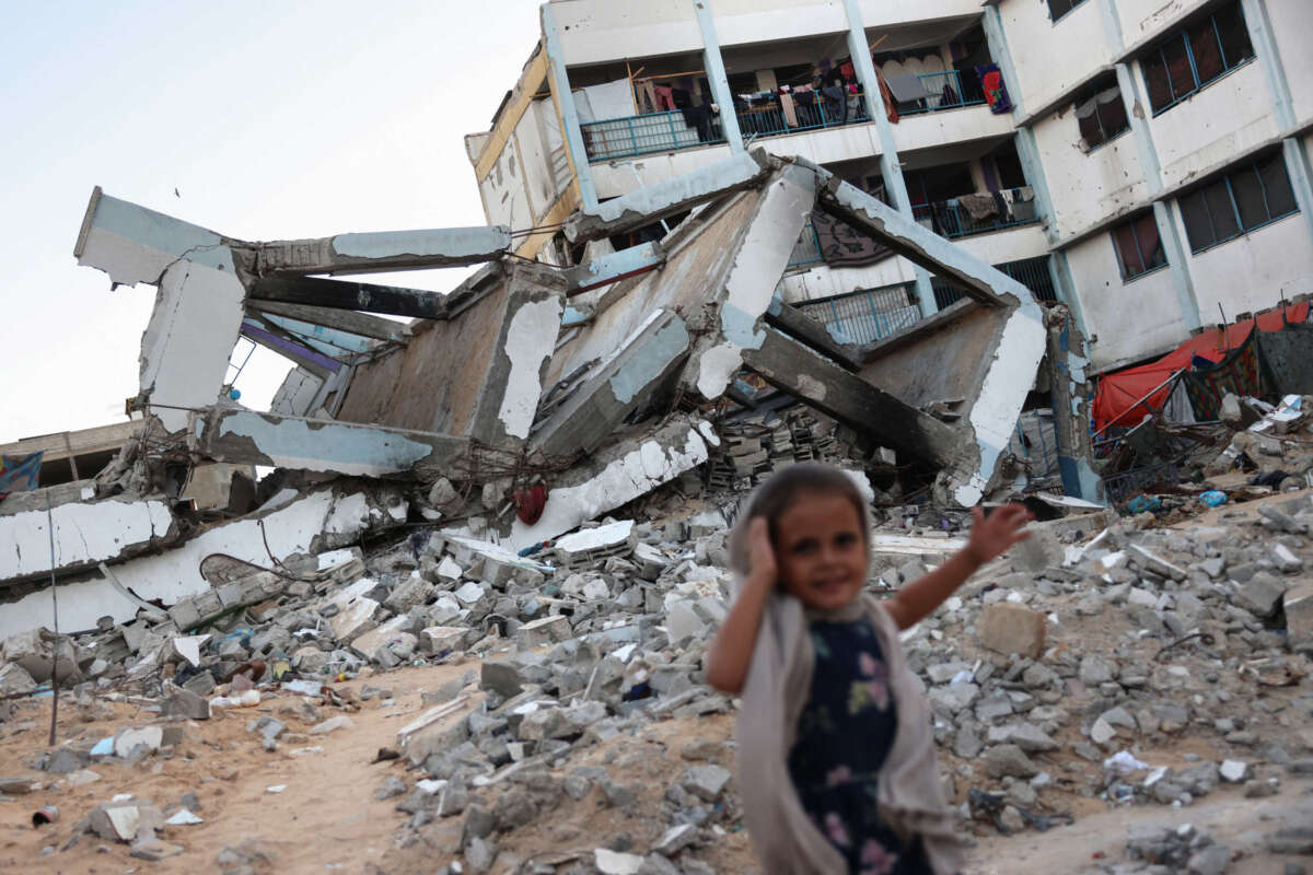 A girl stands on September 17, 2024, at a school destroyed by Israeli strikes in Khan Yunis in the southern Gaza Strip.