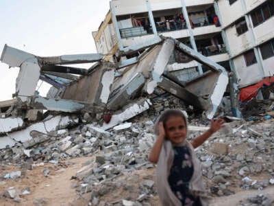 A girl stands on September 17, 2024, at a school destroyed by Israeli strikes in Khan Yunis in the southern Gaza Strip.