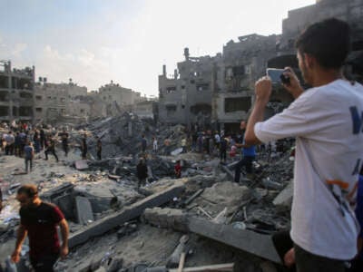 Palestinians check the destruction in the aftermath of an Israeli strike the previous night in the Jabalia camp for Palestinian refugees in the Gaza Strip, on November 1, 2023.