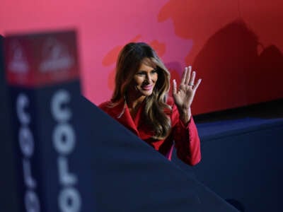 Former first lady Melania Trump waves to the crowd as she walks to the VIP box on the final night of the Republican National Convention at Fiserv Forum on July 18, 2024, in Milwaukee, Wisconsin.