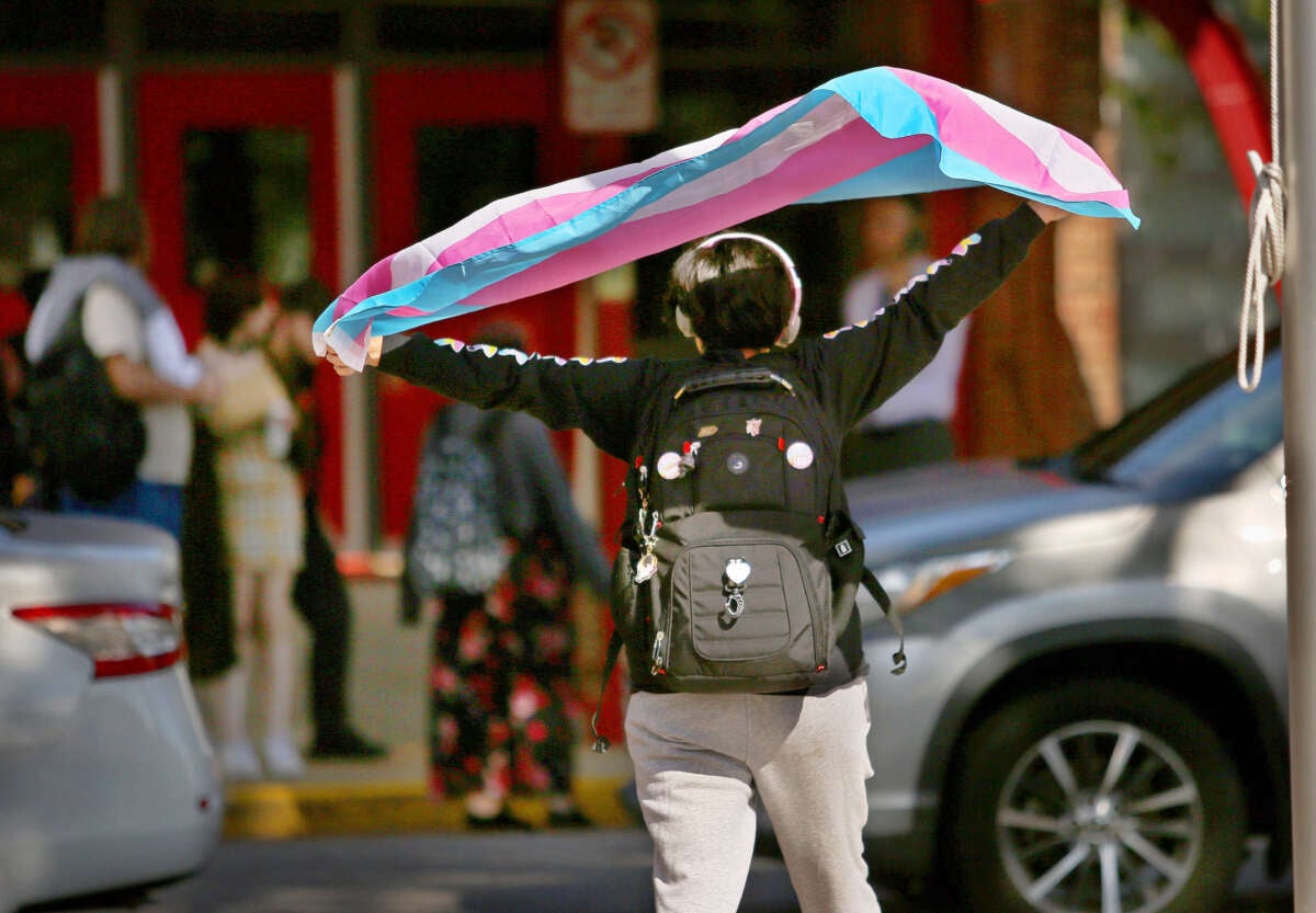 A Bayside High School student protests the governor's new transgender policies in front of the school on February 13, 2024, in Virginia Beach, Virginia.