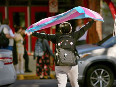 A Bayside High School student protests the governor's new transgender policies in front of the school on February 13, 2024, in Virginia Beach, Virginia.