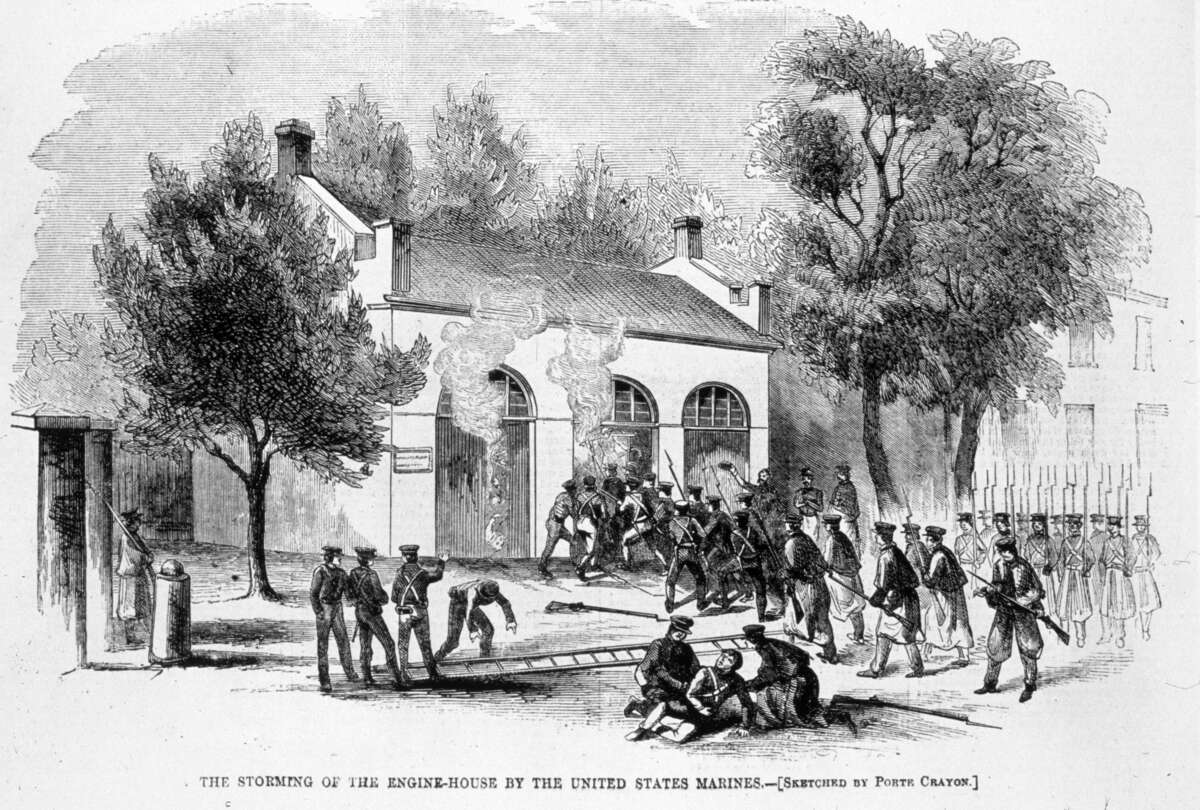 An illustration depicts American marines storming the engine house at Harpers Ferry, West Virginia, after it was captured by the abolitionist John Brown.