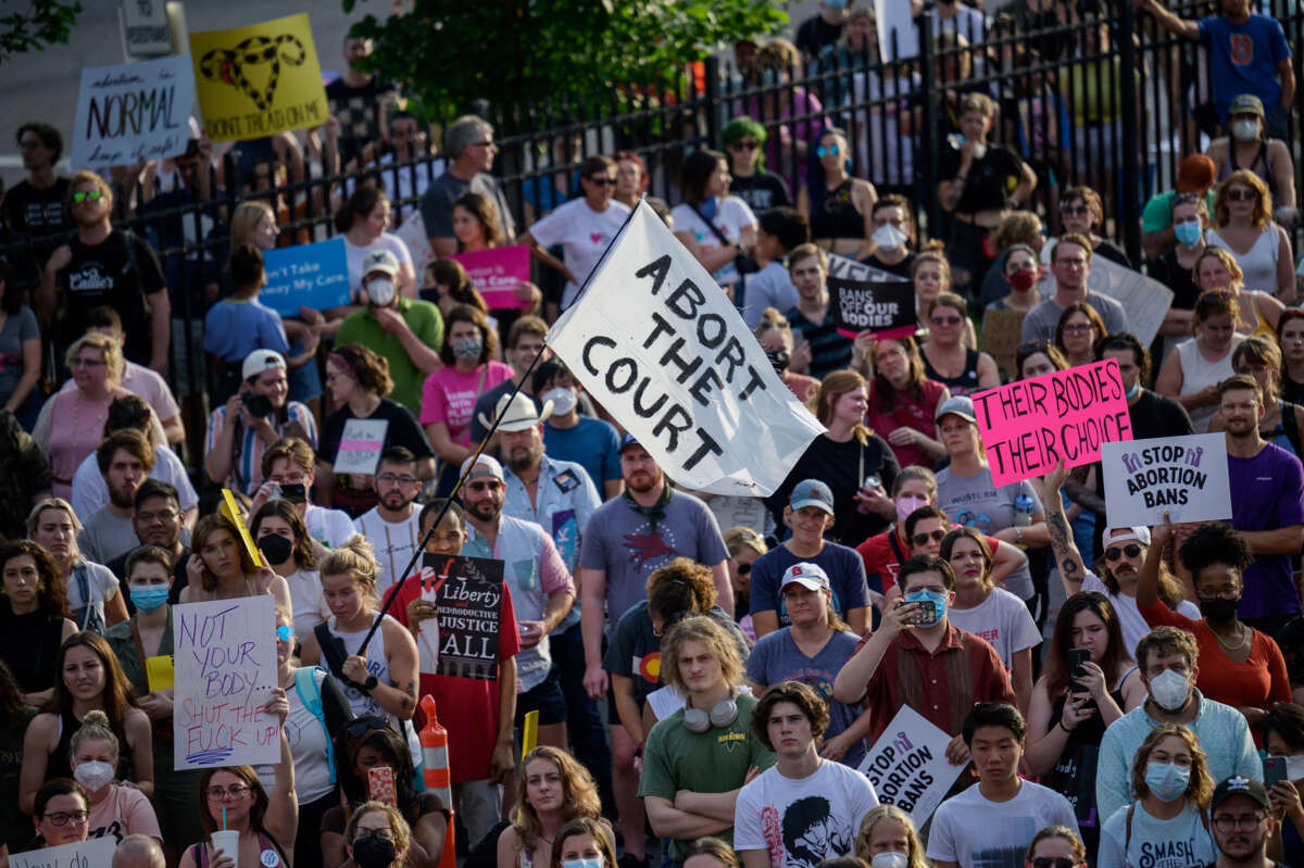 People gather for a rally in support of continued abortion access