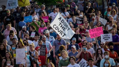 People gather for a rally in support of continued abortion access