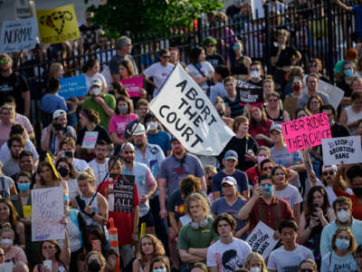 People gather for a rally in support of continued abortion access