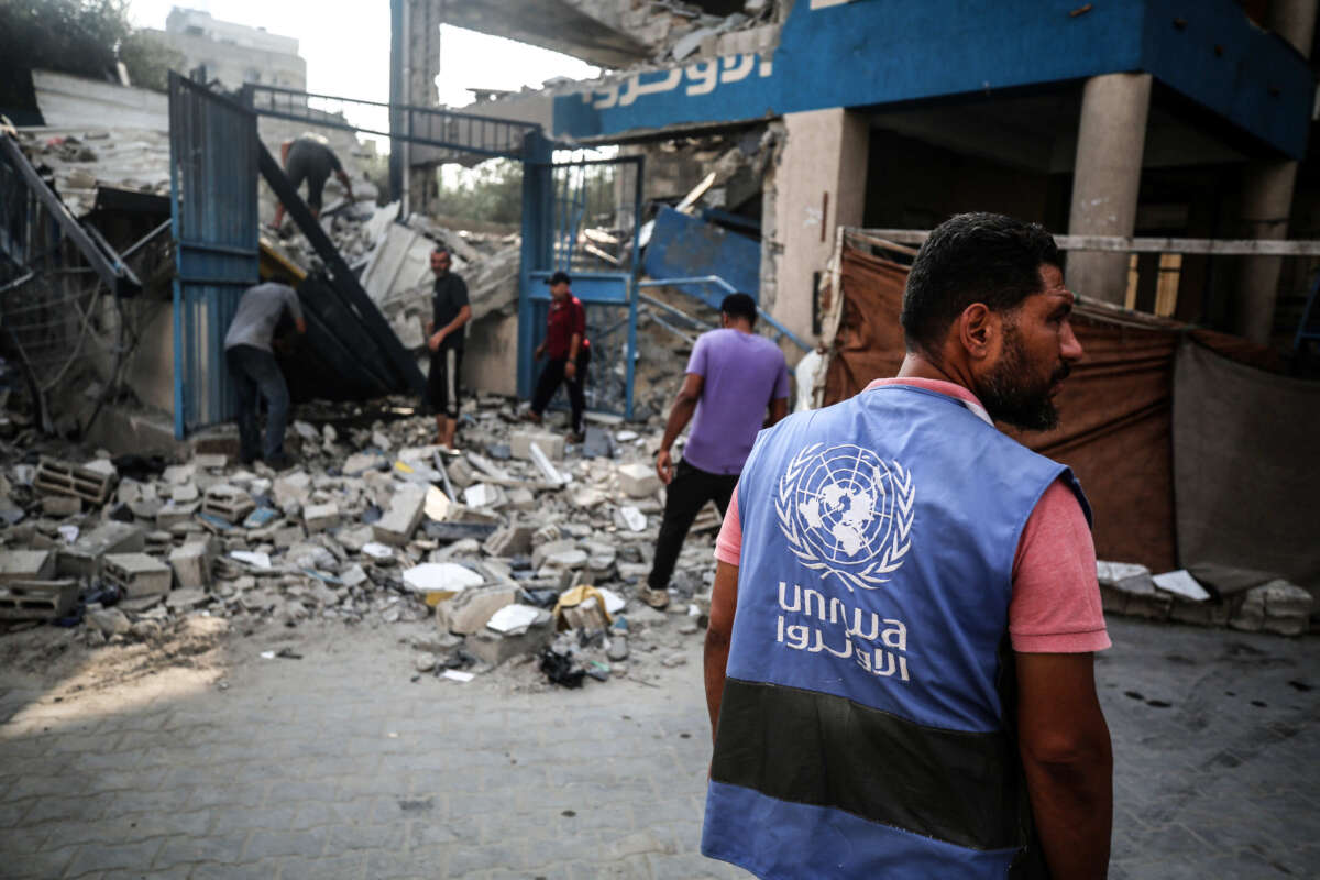 A member of the United Nations is checking the destruction at a school run by the UN Relief and Works Agency for Palestine Refugees (UNRWA) that was previously hit by Israeli bombardment, in the Nuseirat camp in the central Gaza Strip on July 15, 2024.