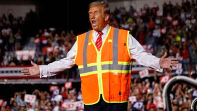 Republican presidential nominee, former President Donald Trump greets supporters during a campaign event at the Resch Center on October 30, 2024, in Green Bay, Wisconsin.