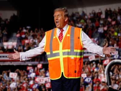 Republican presidential nominee, former President Donald Trump greets supporters during a campaign event at the Resch Center on October 30, 2024, in Green Bay, Wisconsin.