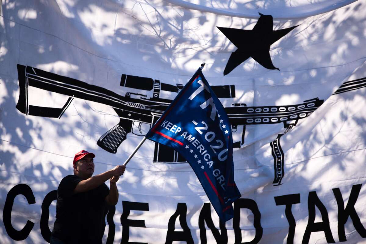 Protesters fly pro-Trump and pro-gun flags outside of then-Democratic presidential candidate Mike Bloomberg’s speaking engagement at the Viva Villa restaurant in San Antonio, Texas, on January 11, 2020.