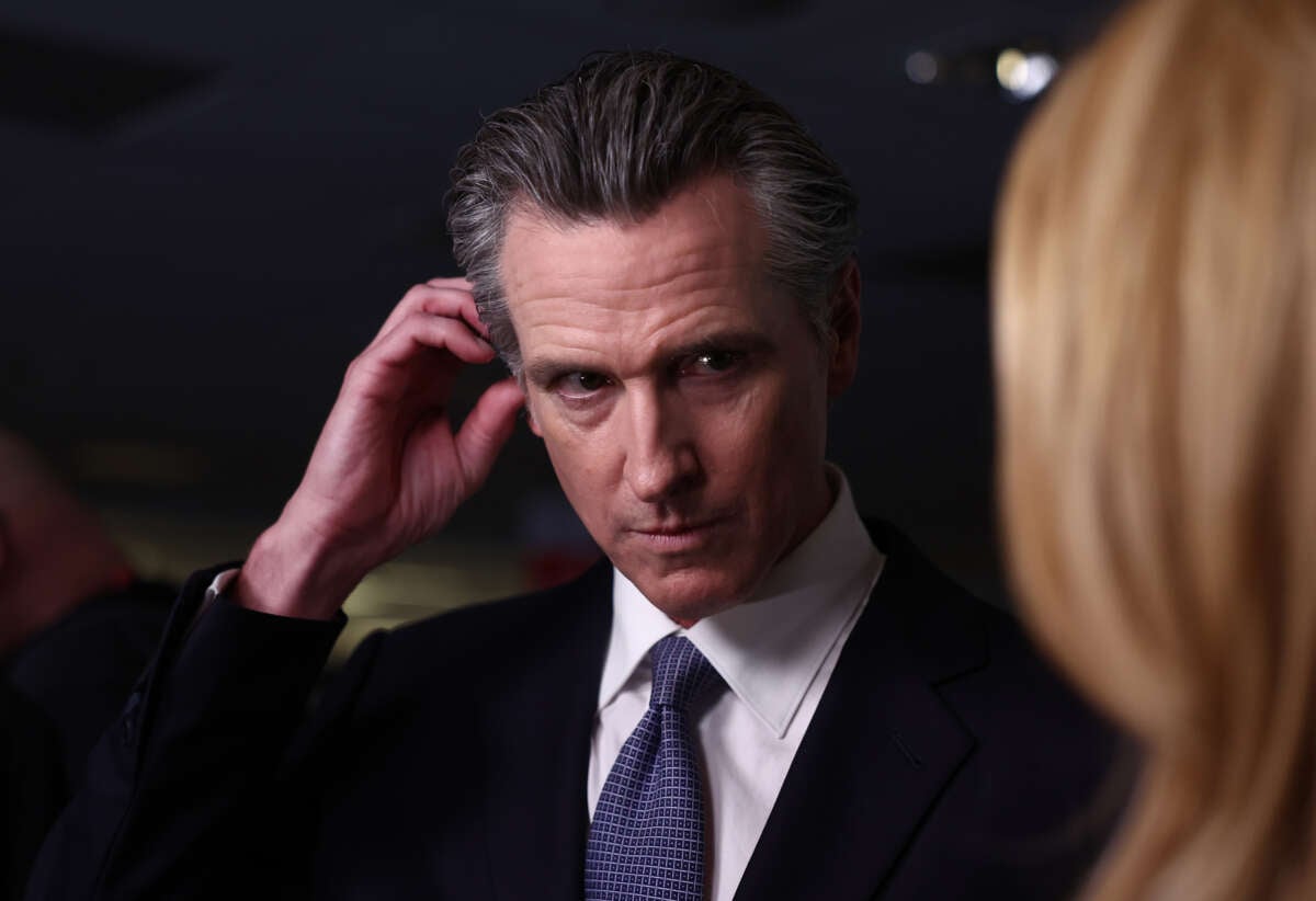 California Gov. Gavin Newsom talks to reporters in the spin room following the FOX Business Republican Primary Debate at the Ronald Reagan Presidential Library on September 27, 2023, in Simi Valley, California.