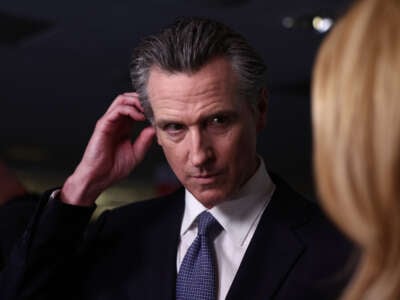 California Gov. Gavin Newsom talks to reporters in the spin room following the FOX Business Republican Primary Debate at the Ronald Reagan Presidential Library on September 27, 2023, in Simi Valley, California.