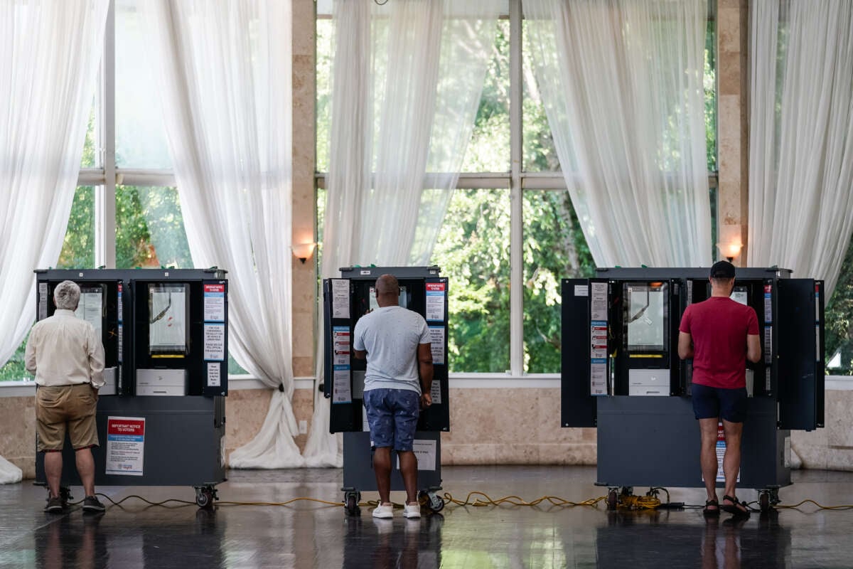 Voters cast ballots in Georgia's primary election at a polling location on May 21, 2024, in Atlanta, Georgia.