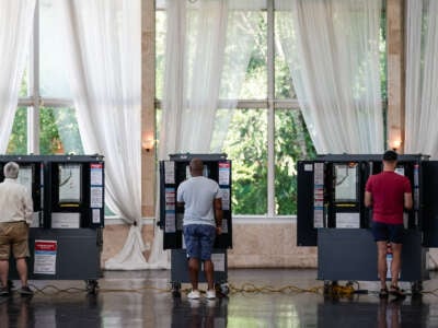 Voters cast ballots in Georgia's primary election at a polling location on May 21, 2024, in Atlanta, Georgia.