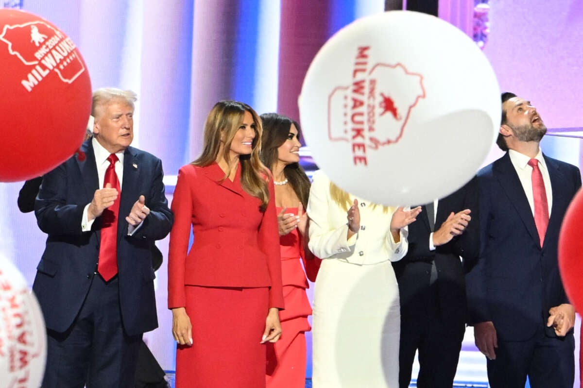 Balloons fall as Donald Trump stands alongside Melania Trump and family after he accepted his party's nomination on the last day of the 2024 Republican National Convention in Milwaukee, Wisconsin, on July 18, 2024.