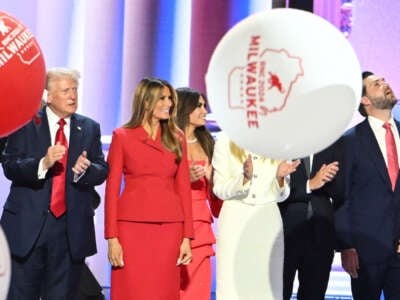 Balloons fall as Donald Trump stands alongside Melania Trump and family after he accepted his party's nomination on the last day of the 2024 Republican National Convention in Milwaukee, Wisconsin, on July 18, 2024.