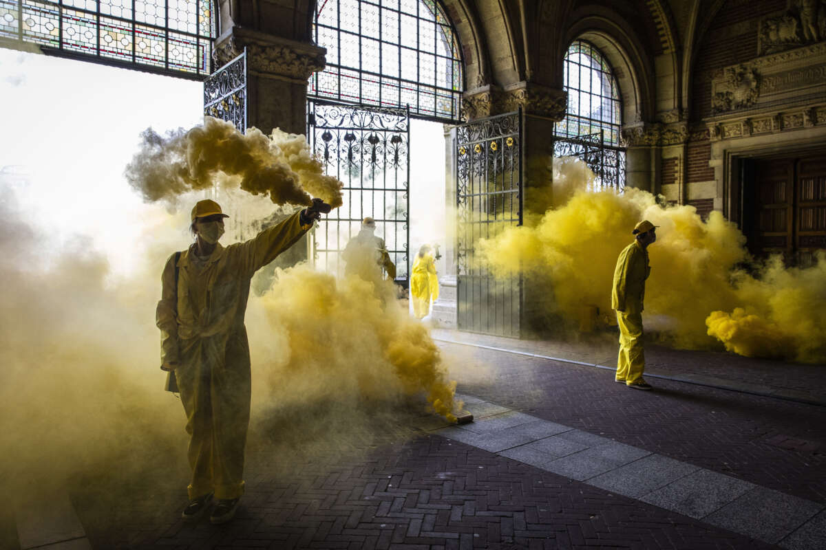 Climate activists of Extinction Rebellion, a global environmental movement, stage a protest at an entrance of the Rijksmuseum in Amsterdam, Netherlands, on September 7, 2024, to protest against the museum's main sponsor ING.