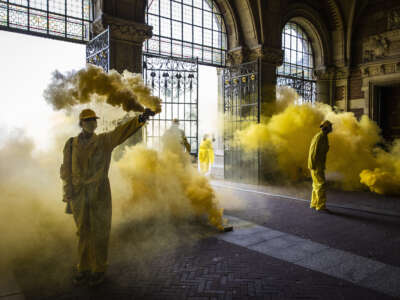 Climate activists of Extinction Rebellion, a global environmental movement, stage a protest at an entrance of the Rijksmuseum in Amsterdam, Netherlands, on September 7, 2024, to protest against the museum's main sponsor ING.