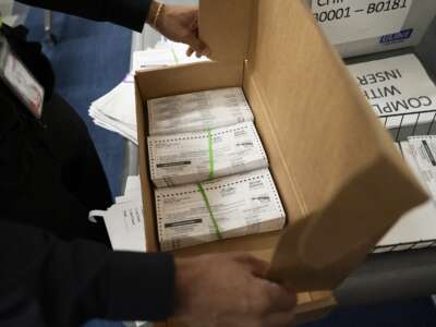 Absentee ballots are prepared to be mailed to military and overseas citizens at the Wake County Board of Elections on September 17, 2024, in Raleigh, North Carolina.