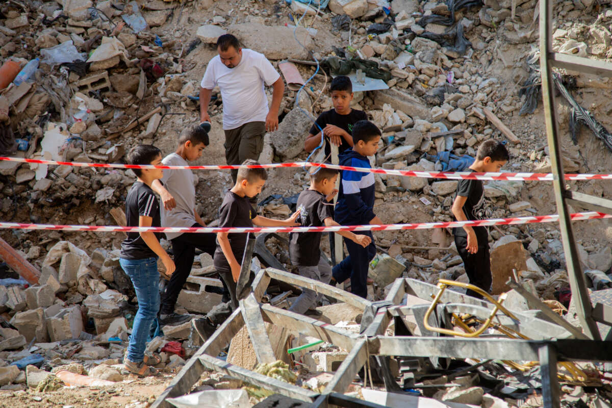 Palestinian children inspect the damage on the site of an Israeli airstrike on the Tulkarem refugee camp in the north of the occupied West Bank, Palestine, on October 4, 2024.