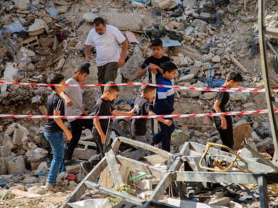 Palestinian children inspect the damage on the site of an Israeli airstrike on the Tulkarem refugee camp in the north of the occupied West Bank, Palestine, on October 4, 2024.