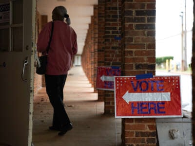 People arrive to cast their votes on the first day of early voting at East Point First Mallalieu United Methodist Church on October 15, 2024, in Atlanta, Georgia.