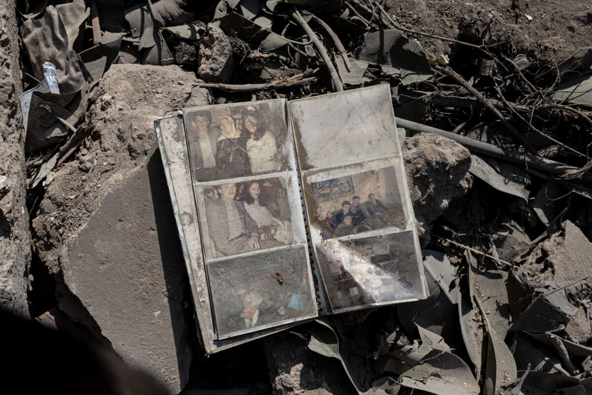 A photo album lies in the rubble of a building destroyed by an Israeli airstrike in the Ras al-Nabaa district on October 11, 2024, in Beirut, Lebanon.