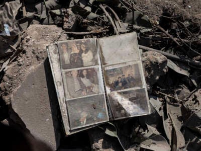 A photo album lies in the rubble of a building destroyed by an Israeli airstrike in the Ras al-Nabaa district on October 11, 2024, in Beirut, Lebanon.