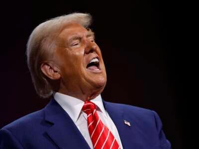 Former President Donald Trump delivers remarks during a campaign rally at the Cobb Energy Performing Arts Centre on October 15, 2024, in Atlanta, Georgia.