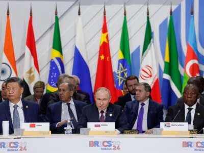 Officials -- including South African President Cyril Ramaphosa, Russian President Vladimir Putin and Chinese President Xi Jinping -- attend a plenary session in the outreach/BRICS Plus format at the BRICS summit in Kazan, Russia, on October 24, 2024.