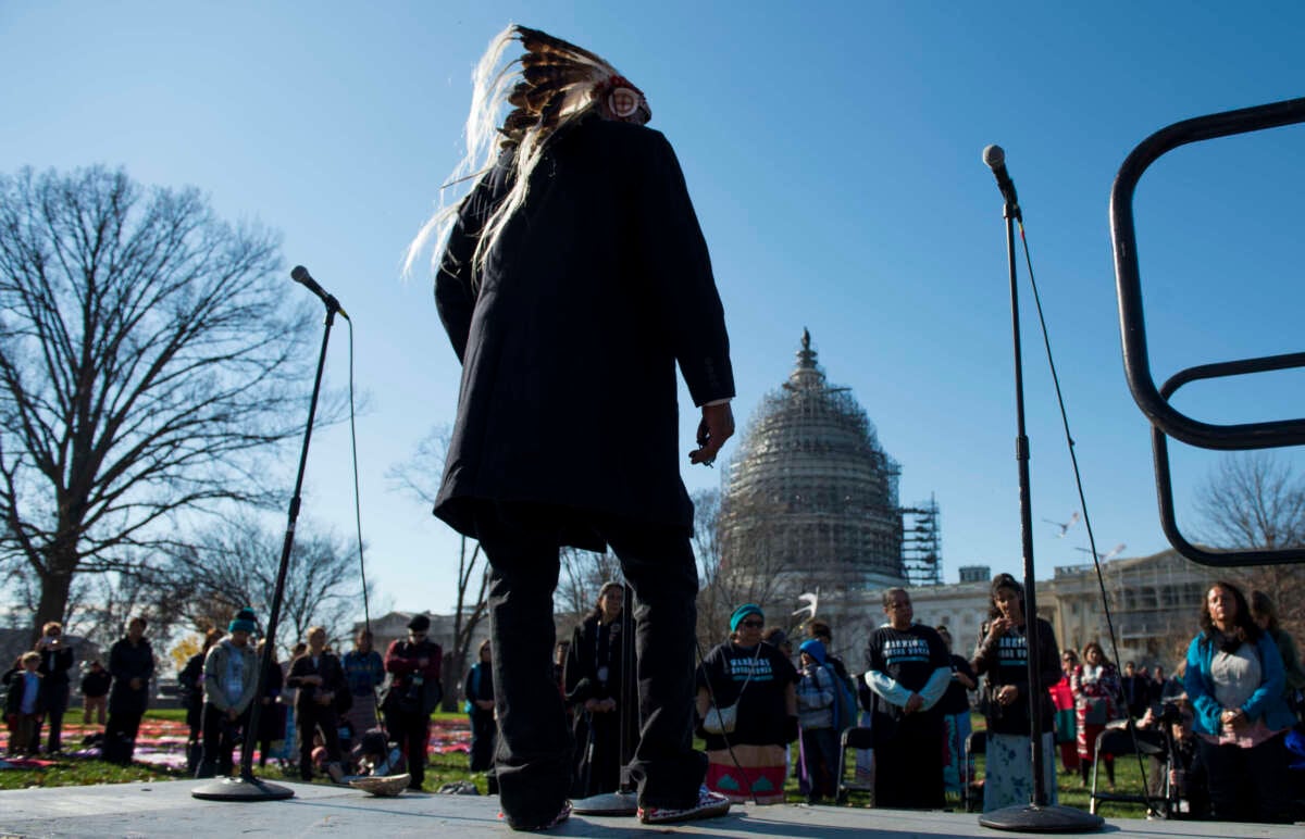 Chief Arvol Looking Horse, of the Sioux Tribe, delivers a prayer during the rally in front of the United States Supreme Court on the East Front of the U.S. Capitol, on December 7, 2015.