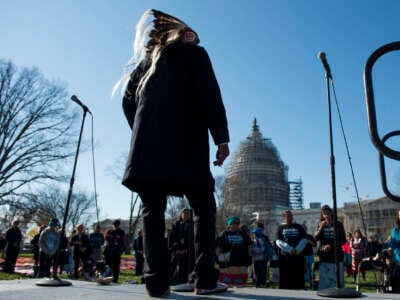 Chief Arvol Looking Horse, of the Sioux Tribe, delivers a prayer during the rally in front of the United States Supreme Court on the East Front of the U.S. Capitol, on December 7, 2015.