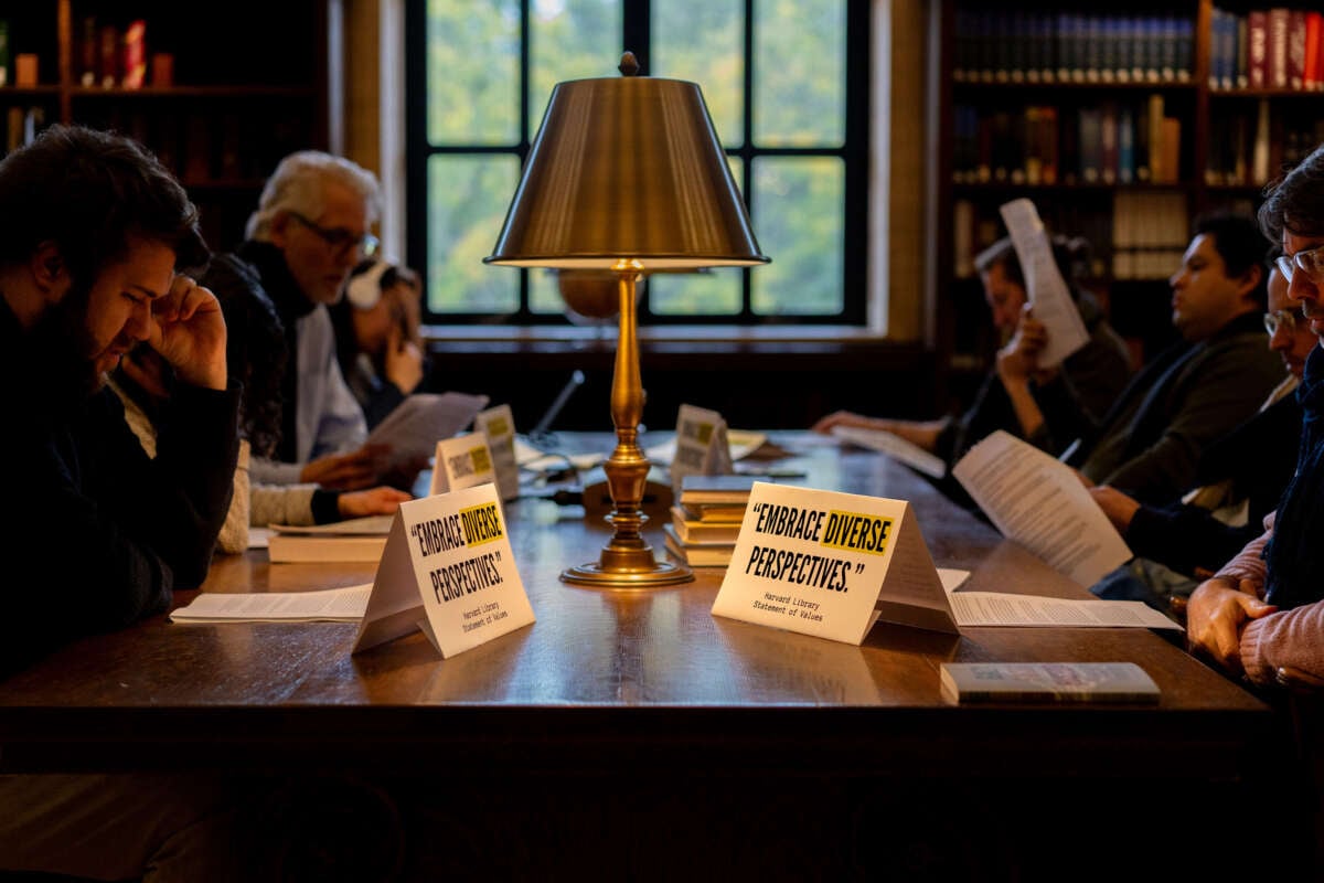 Harvard professors hold a silent study session in the university’s central library on October 16, 2024.