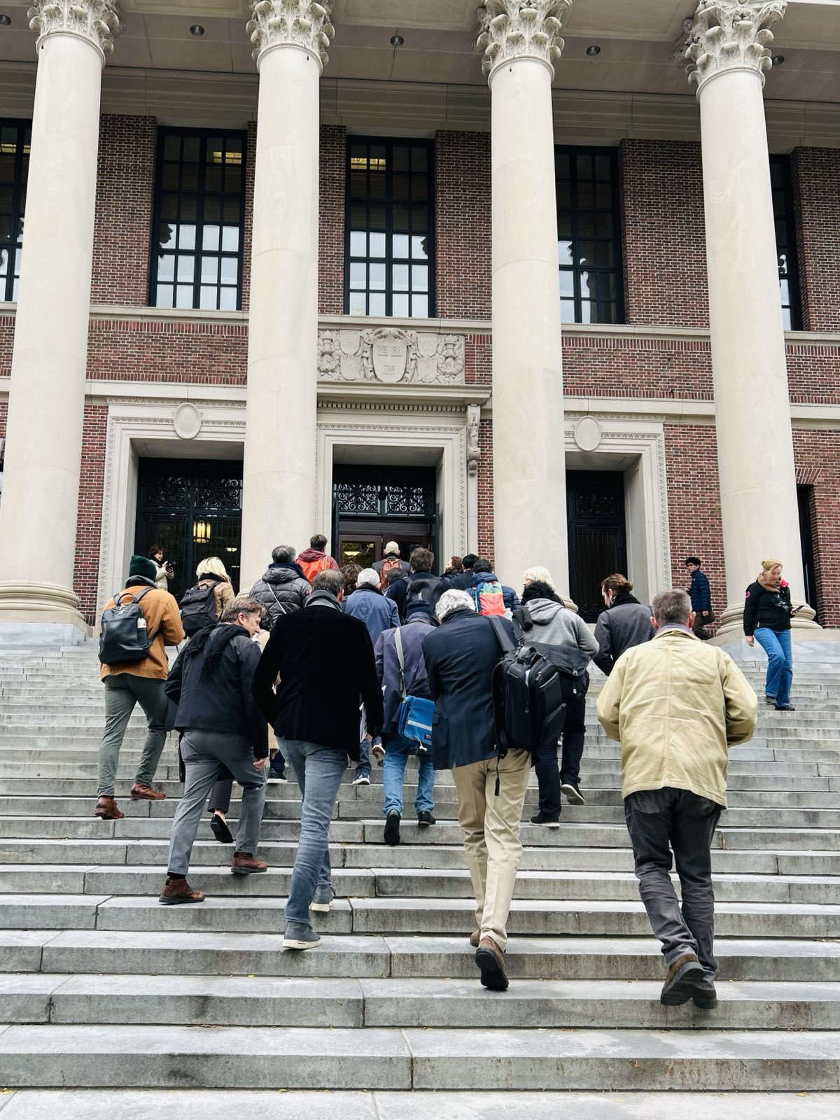 Two dozen Harvard professors enter Widener Library on October 16, 2024, to hold a silent study session in solidarity with students suspended for protests over Gaza and Lebanon.