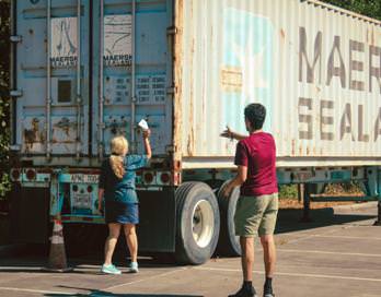 Community members distribute flyers to Maersk workers at an office in the Woodlands, a suburb of Houston, Texas.