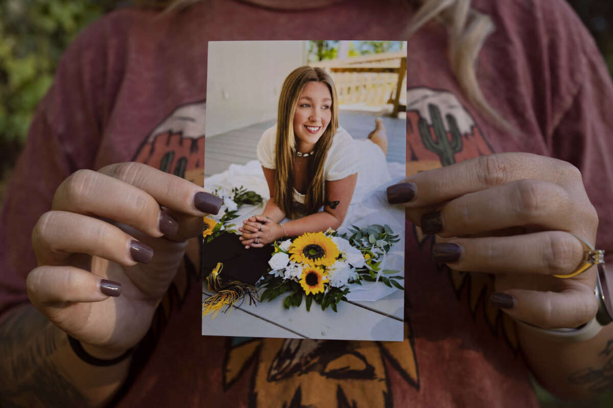 Candace Fails holds a photograph of her daughter Nevaeh Crain, who died last year after seeking help from two hospitals for pregnancy complications.