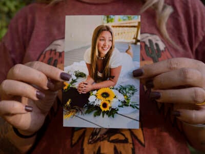 Candace Fails holds a photograph of her daughter Nevaeh Crain, who died last year after seeking help from two hospitals for pregnancy complications.