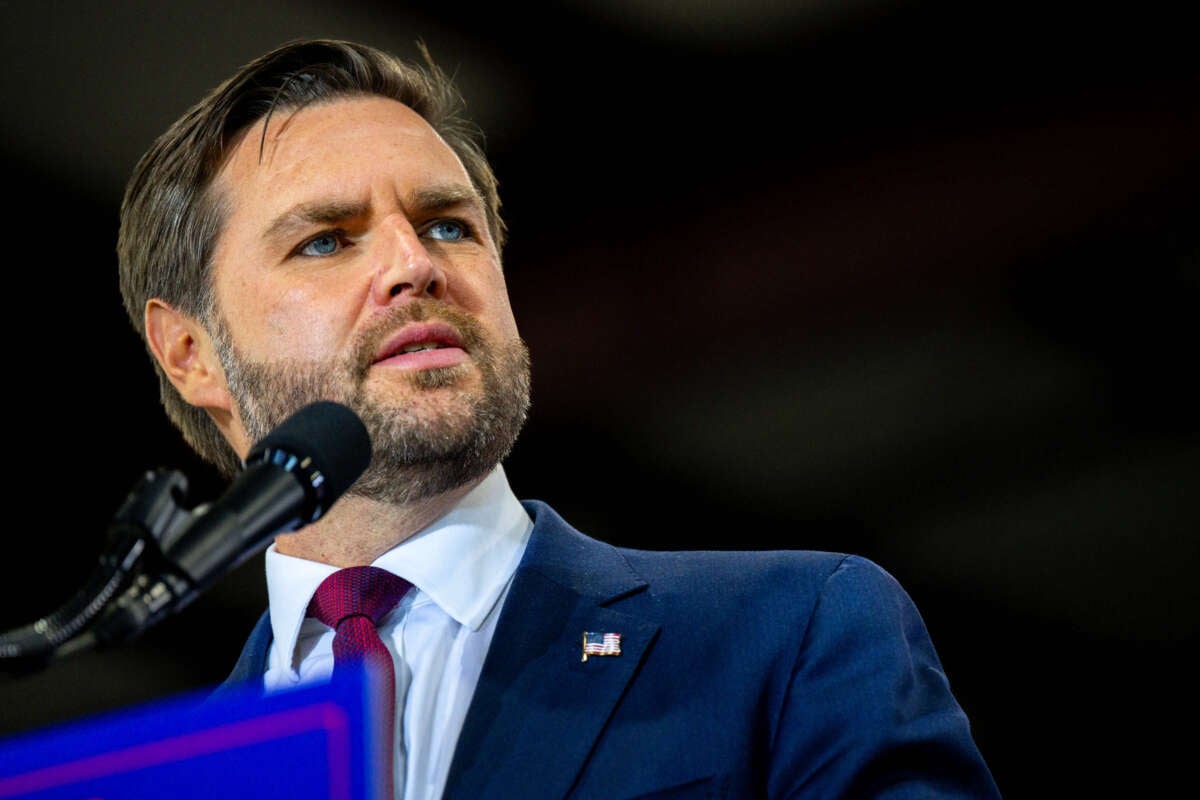 Republican vice presidential nominee, Sen. J.D. Vance speaks during a campaign rally at the Elite Jet at Contact Aviation facility on October 24, 2024, in Waterford, Michigan.