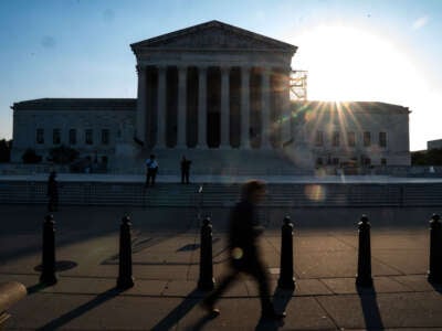 People pass outside the U.S. Supreme Court on October 7, 2024, in Washington, D.C.